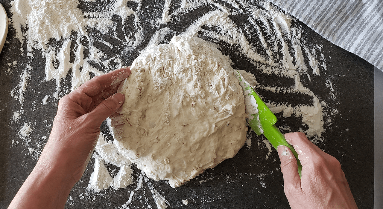 Dirty hands covered in flour after kneading the dough